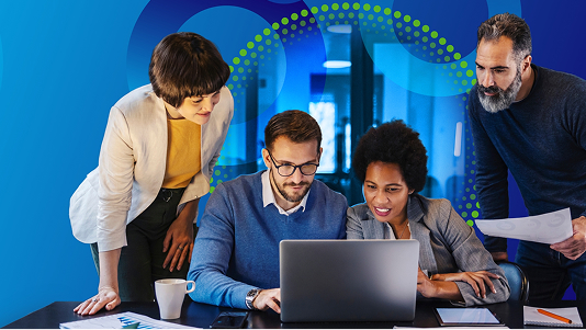 Business team collaborating around a laptop during a procurement strategy session