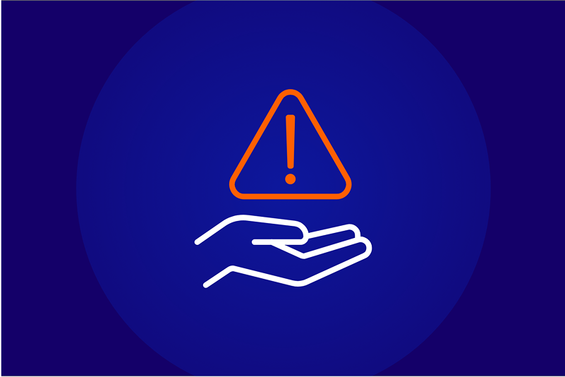Hand holding a warning triangle with an exclamation point, representing procurement risk management