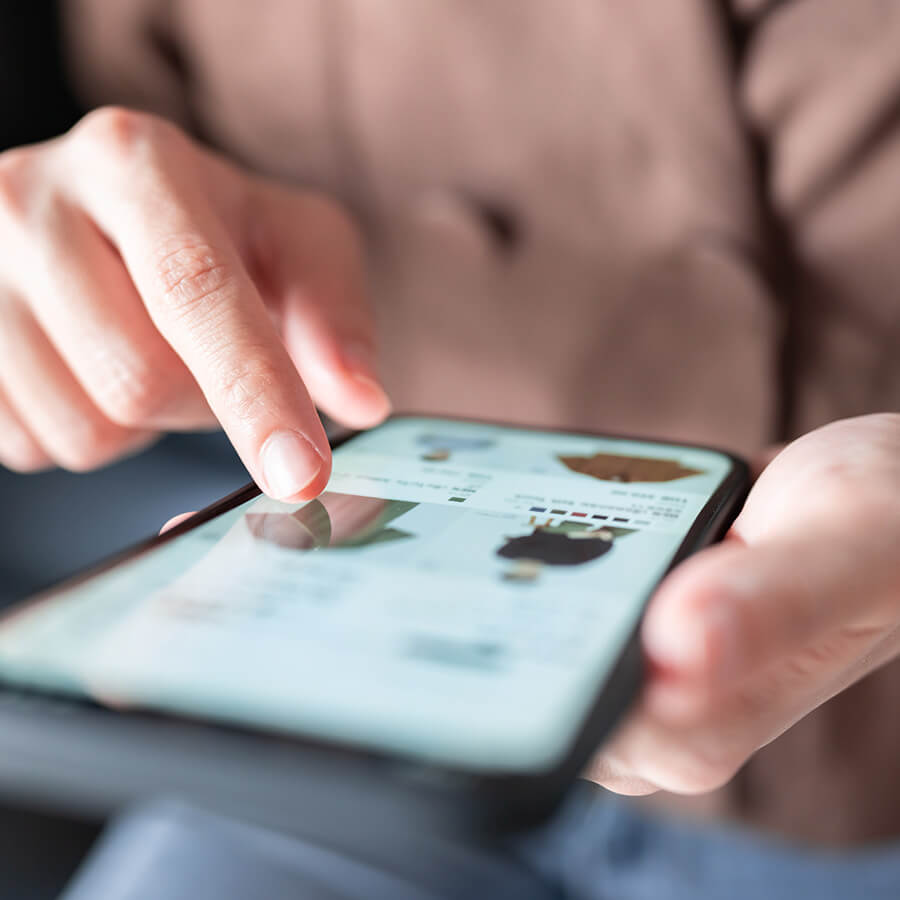 key-take-2.jpg Person scrolling through content on an iPhone