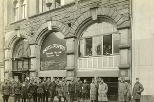 U.S. soldiers and K of C field secretaries stand outside of a K of C hut in Andernach, Germany, circa 1919