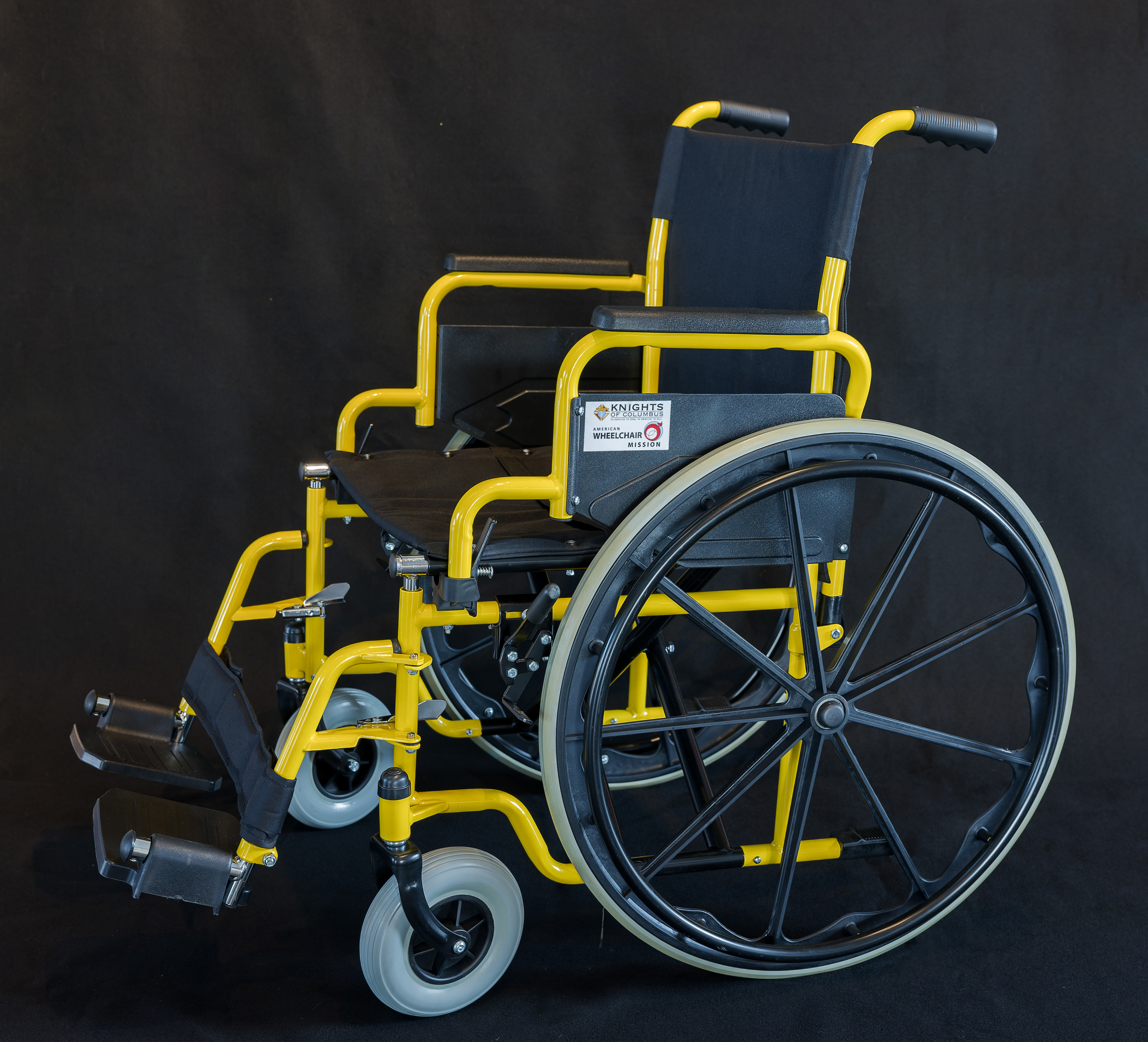 Yellow and black wheelchair provided as part of the Knights of Columbus Global Wheelchair Mission, in partnership with the American Wheelchair Mission