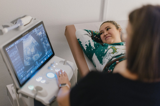 An expectant mother sees images of her unborn baby on a K of C-funded ultrasound machine at Guiding Star Las Cruces.