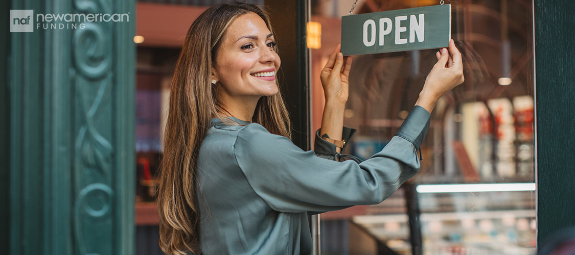 store owner opening her shop