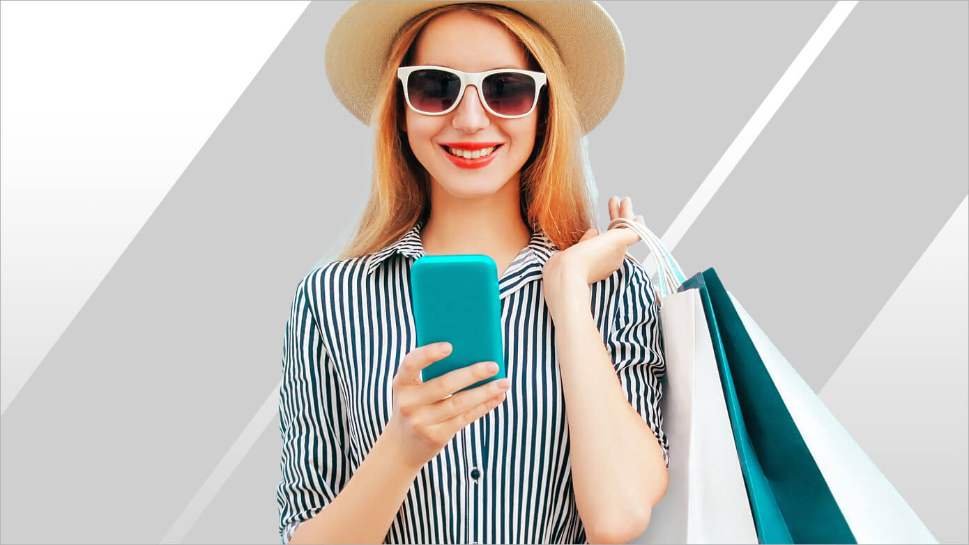 mse-0-card_1390x782.jpg Shopper with bags and looking at an iPhone
