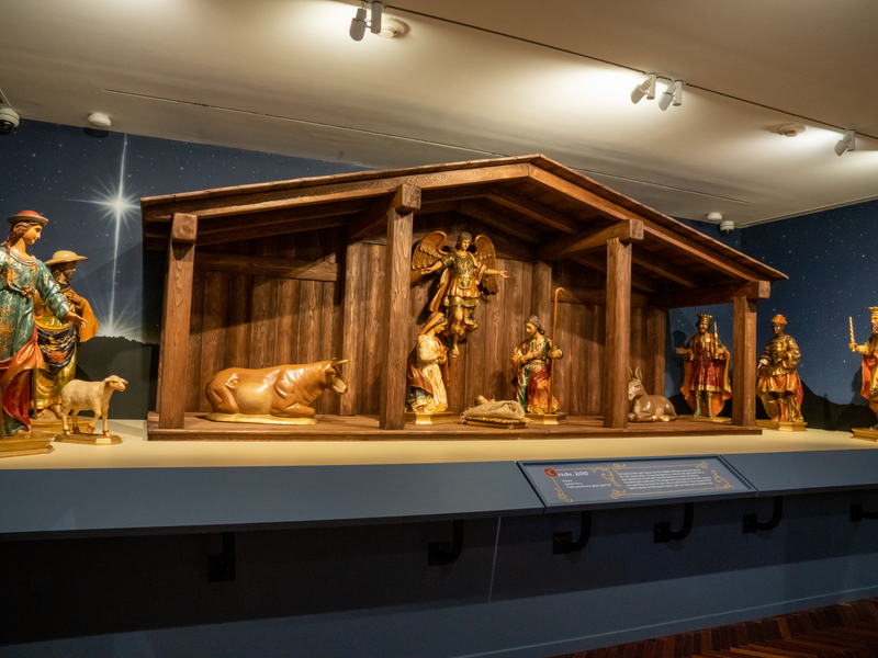 Wood painted Nativity with Holy Family, Angel, 3 Magi, 2 shepherds, a lamb, an ox, and a donkey with a stable.