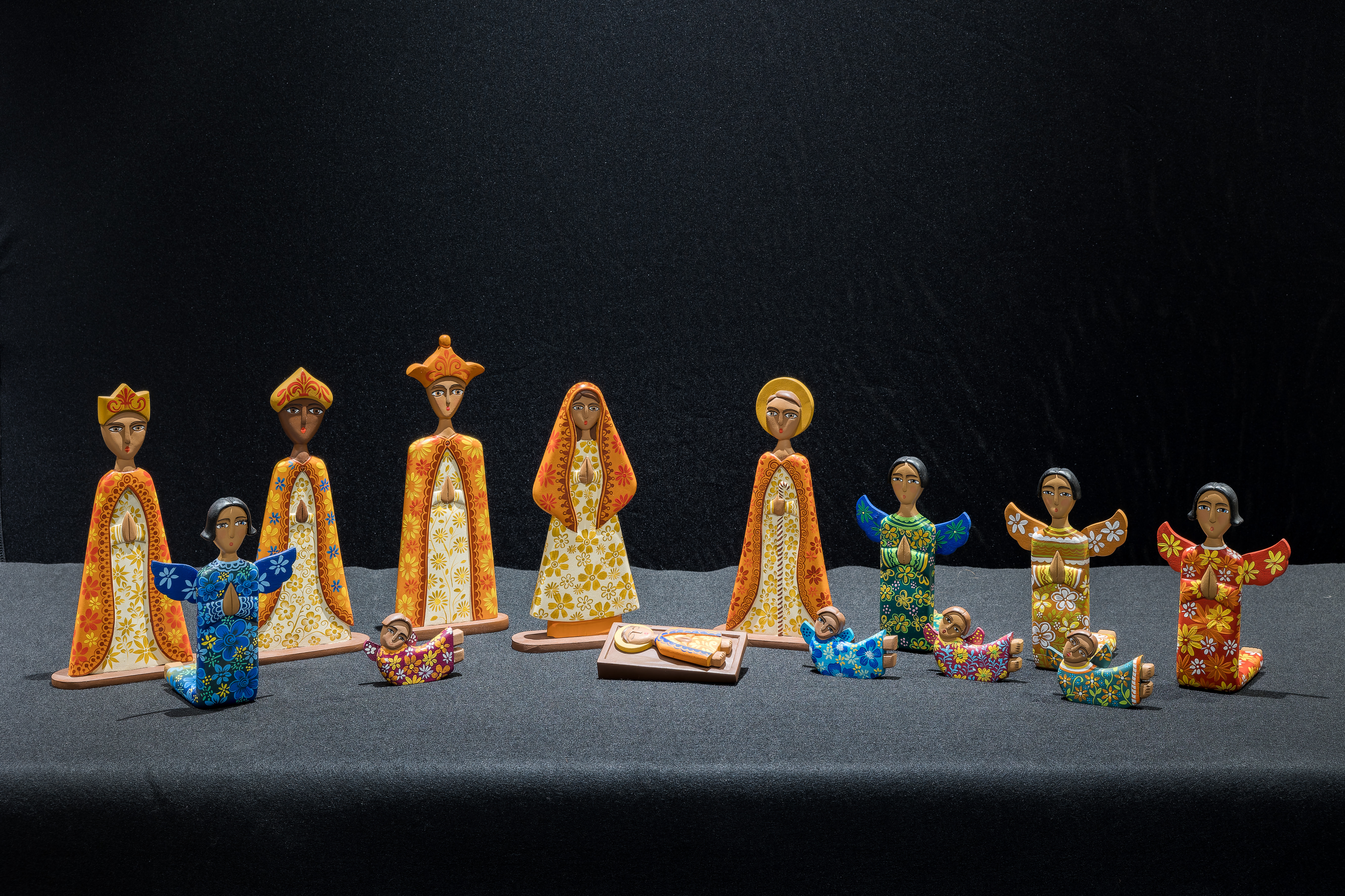 Nativity from Nicaragua with brightly painted figures of the Holy Family, 3 Magi, 4 angels, and 4 cherubs were carved from cedar wood