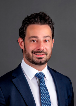 Headshot of Nicholas Gentile, Interim President & Chief Investment Officer, wearing a blue suit and tie