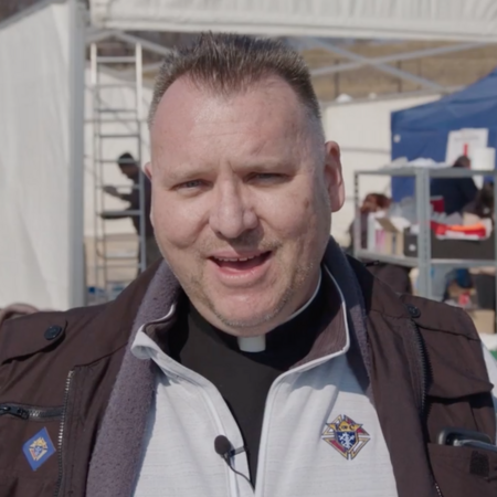 Father Kalisch live in Ukraine, speaking to the camera and offering prayers and healing for the nation