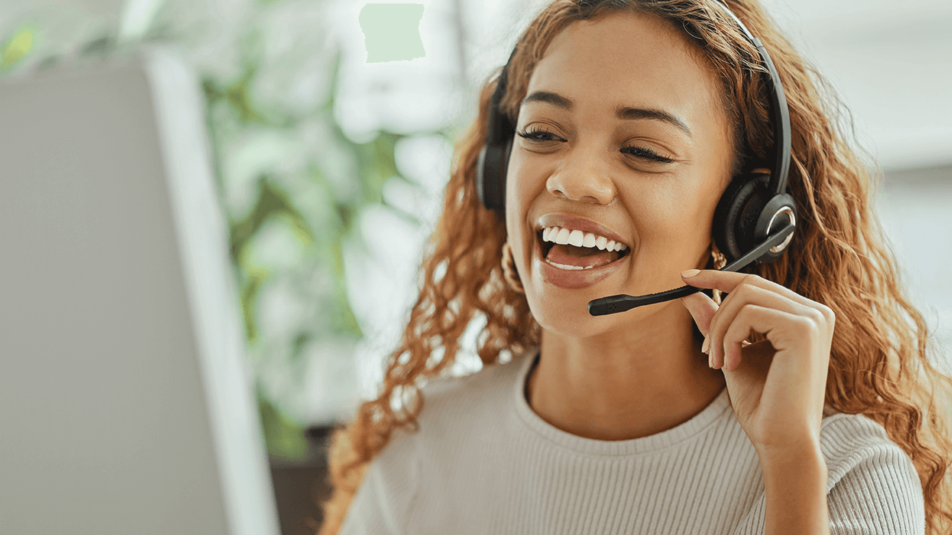 omni-mobile-enhance-experience1390x782.png Image of a woman with a headset talking on the phone.