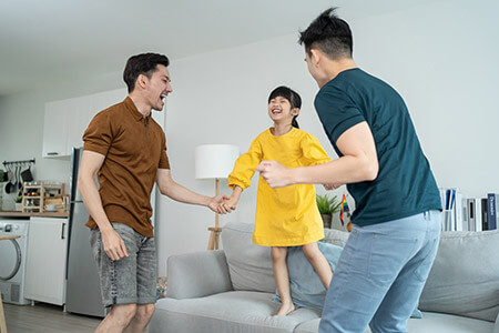 a couple with their couch jumping daughter