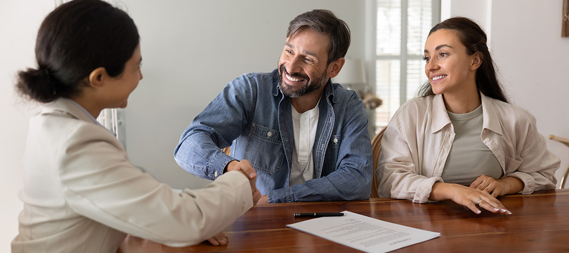 a couple meeting with a loan officer