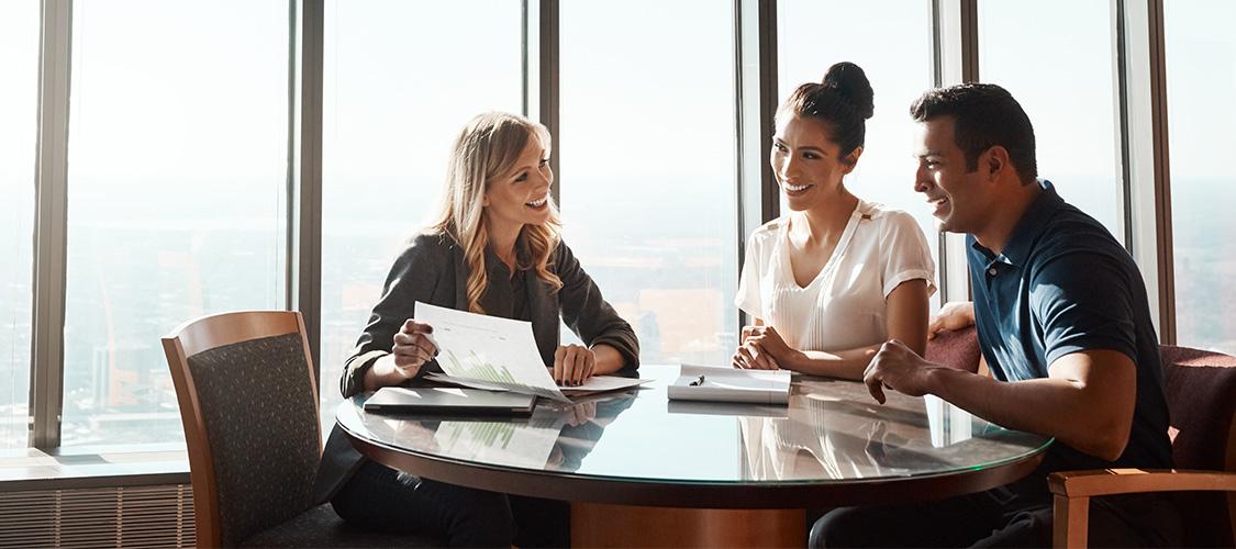 A couple meeting with a financial advisor