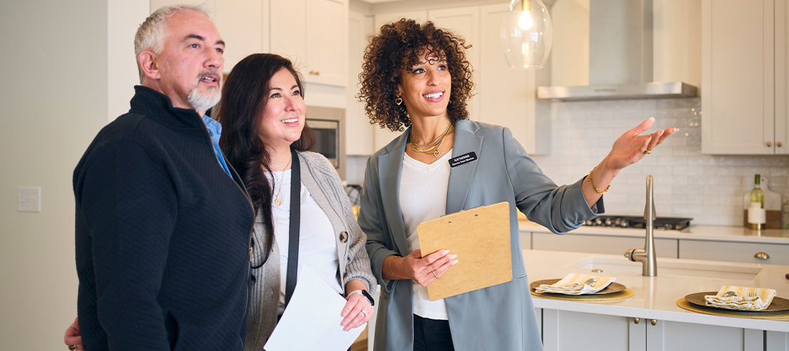 Buyers with real estate agent looking at a home