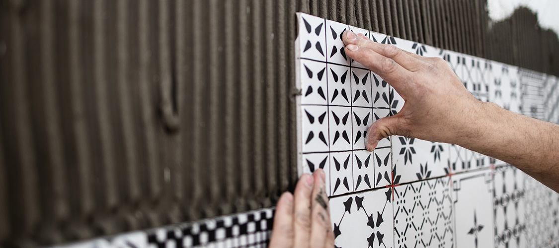 Someone installing new tile