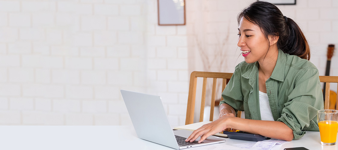 A woman sitting a laptop