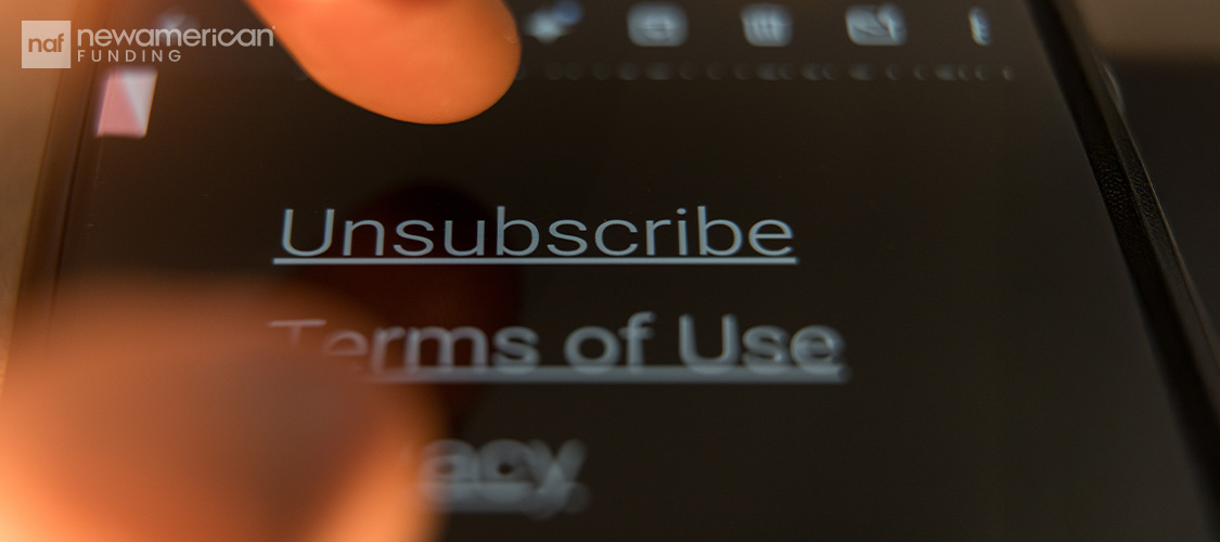 Someone hitting an Unsubscribe button on a screen.