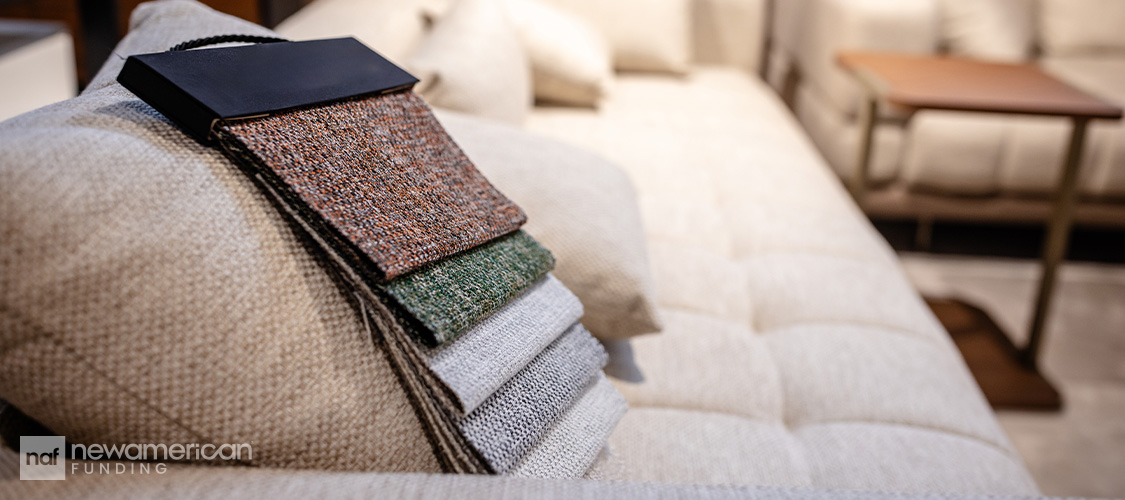 Fabric swatches on a couch.