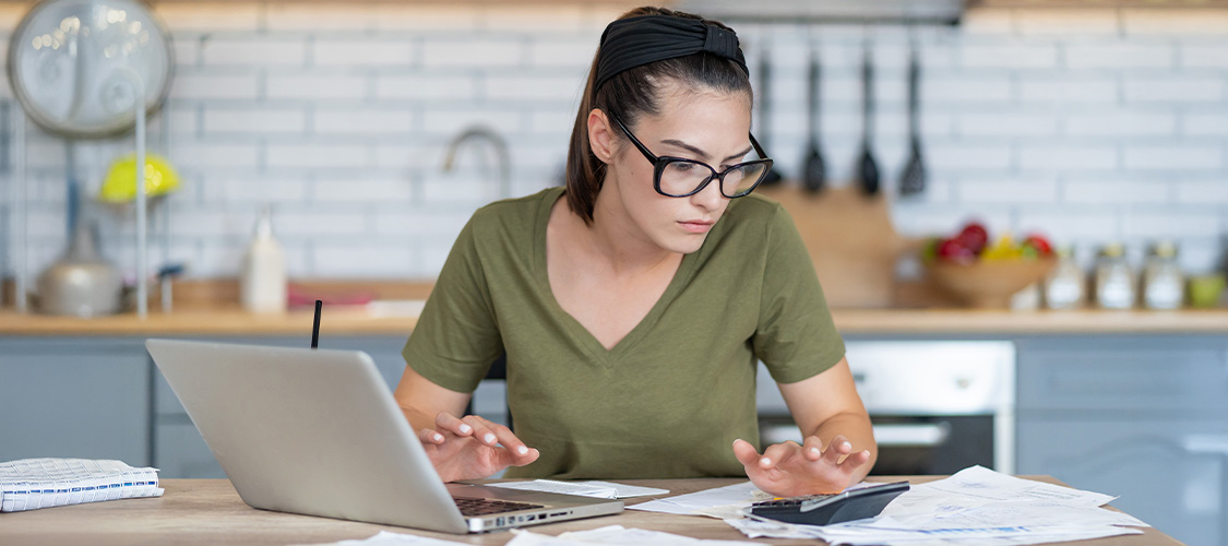 A woman doing calculations on a calculator