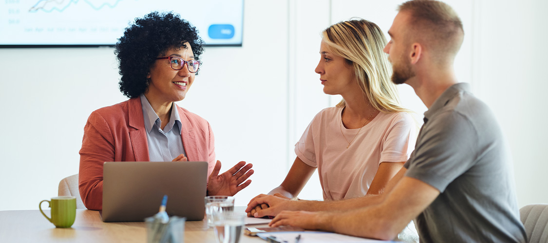 Couple meeting with mortgage professional