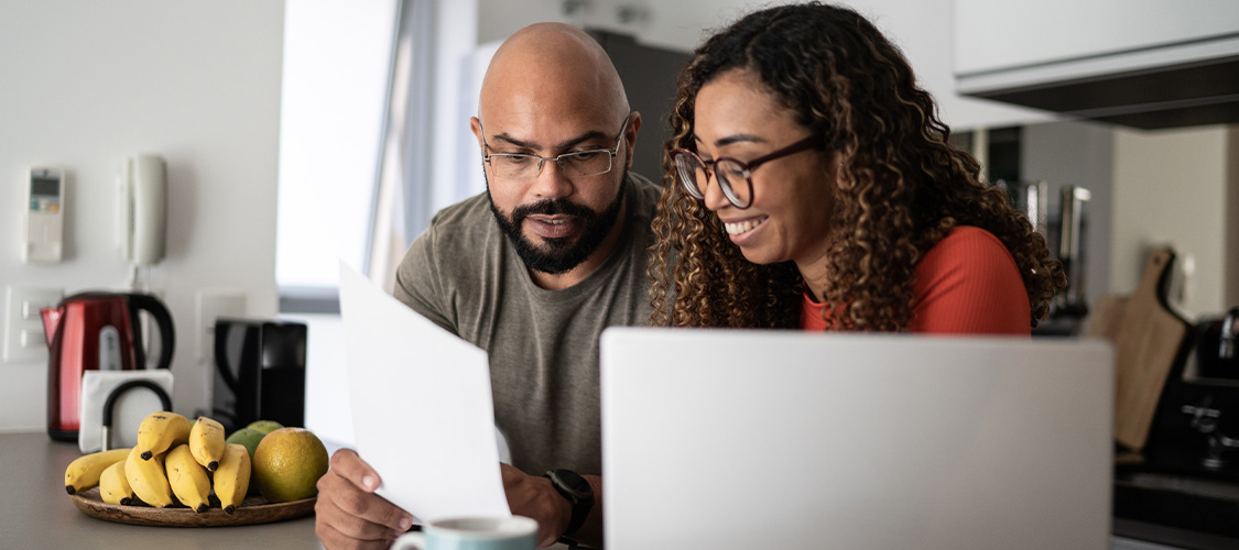 A couple looking at financial documents