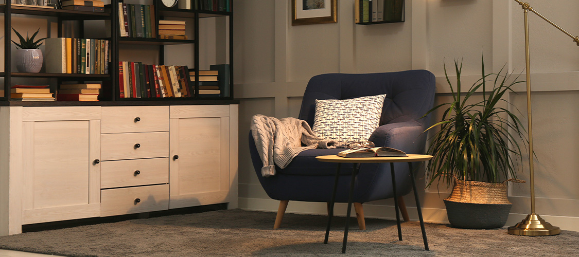 A nook with a comfy chair in it.