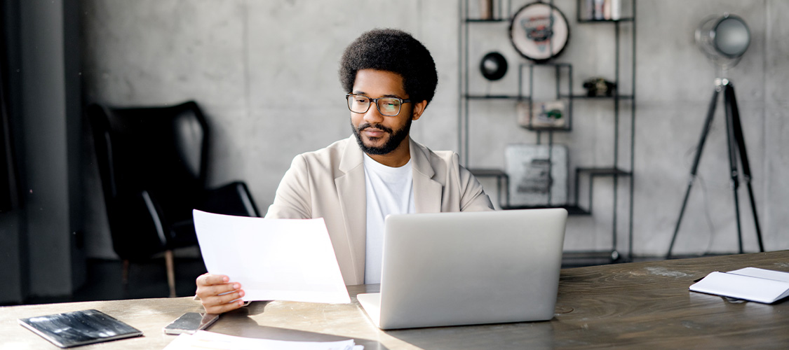 Someone reviewing paperwork