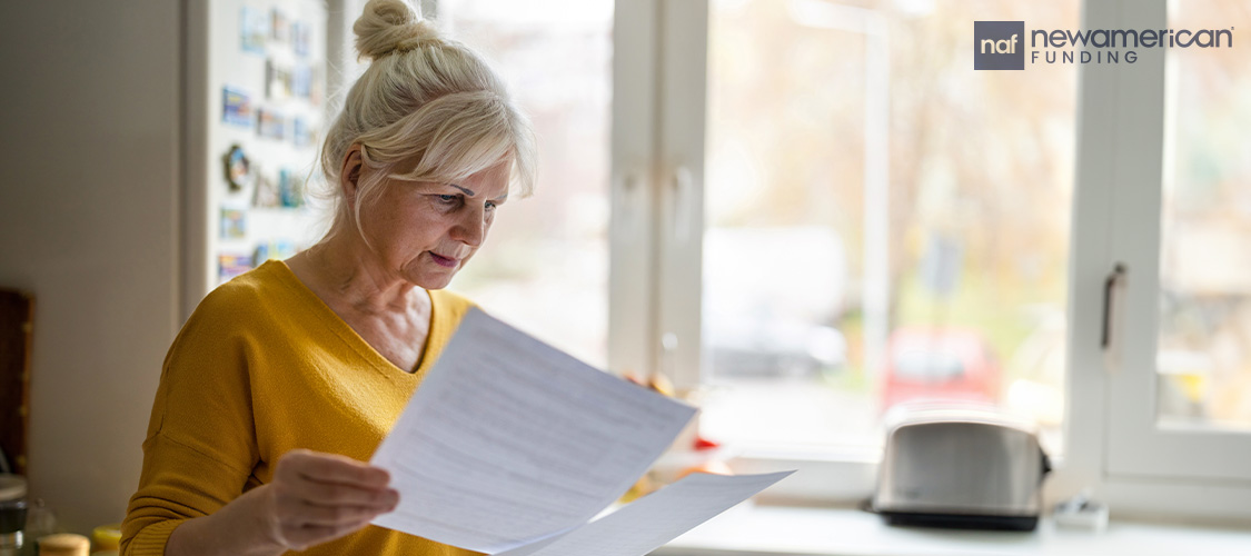 Someone looking through paperwork.