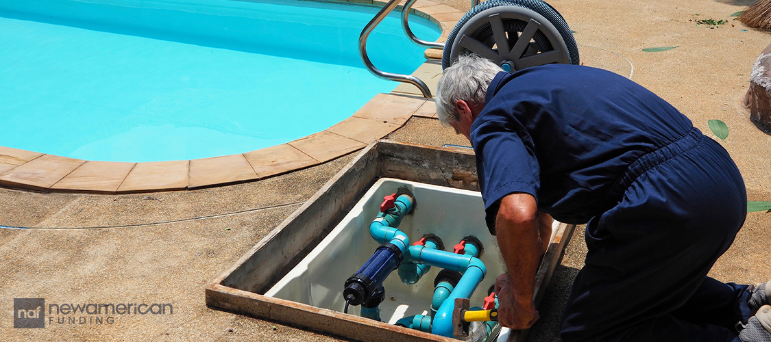A repair person fixing a pool.