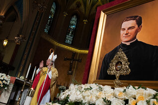 A relic and portrait of Father McGivney are displayed in the sanctuary of St. Mary’s Church