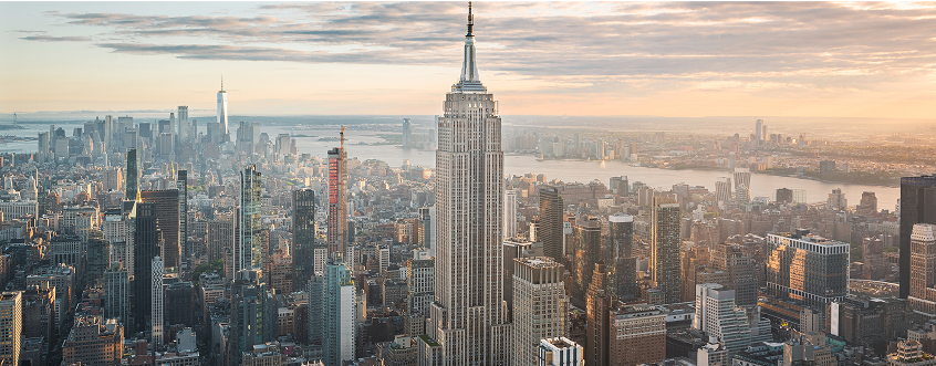 Empire State Building and New York City skyline at sunset, representing the Americas chapter