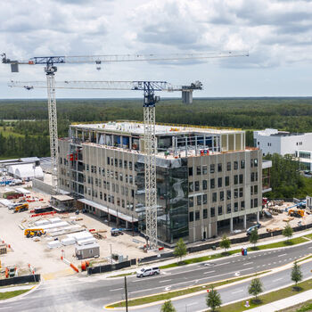 Speros marked major milestones in fiscal year 2025 with the topping out of the Moffitt Discovery and Innovation Center and the arrival of the proton therapy cyclotron from Belgium.