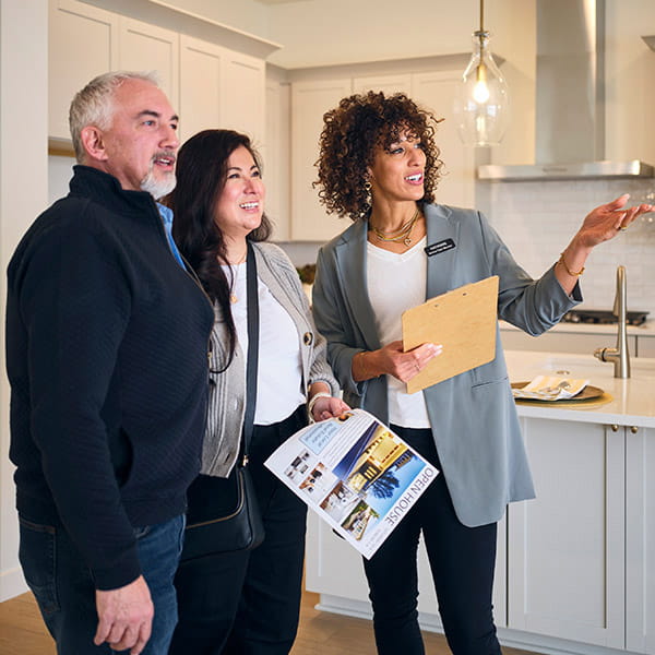 homebuyers viewing a home with a real estate agent