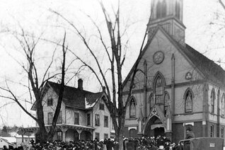 Parishioners gather outside the old St. Thomas Church
