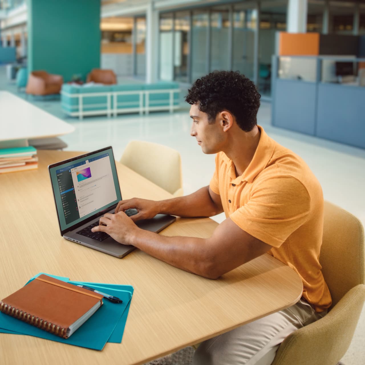 man sitting at desk with computer