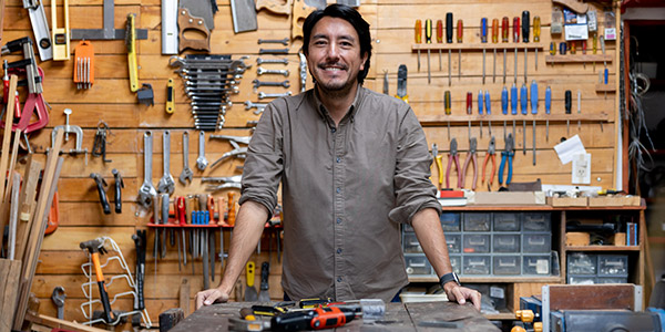 smiling man in his workshop