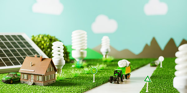 Model of eco-friendly symbols and objects like energy-efficient lightbulbs