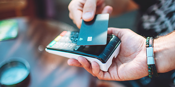 someone swiping their credit card for a purchase