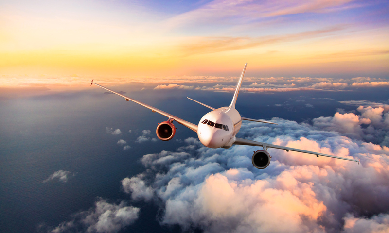 frontal image of an airplane flying towards the you.