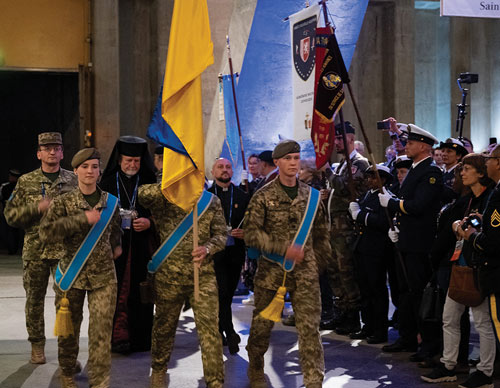 The Ukrainian delegation presents its colors during the International Opening Ceremony