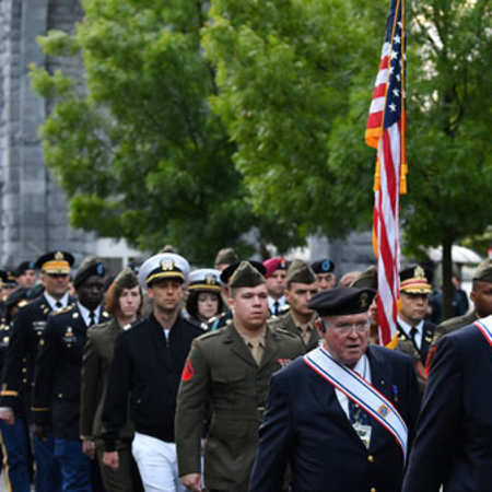 US military pictured in a procession in front of the The Basilica.