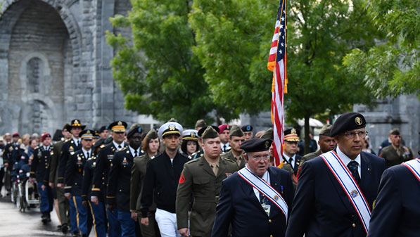 US military pictured in a procession in front of the The Basilica.