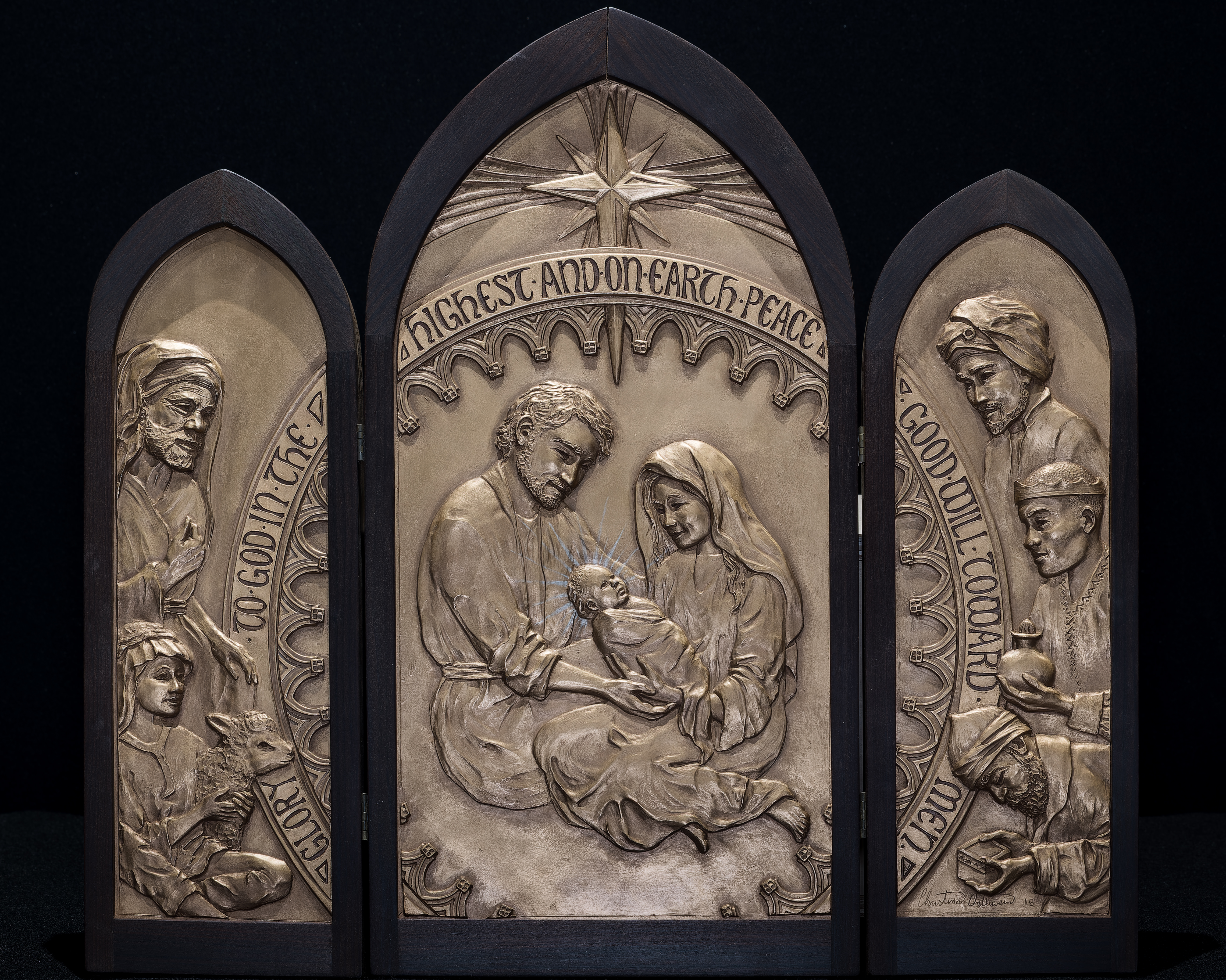 Stoneware triptych depict the Holy Family, 3 Magi, 2 shepherds, and a lamb with visual inspirations from Glencairn Museum. 