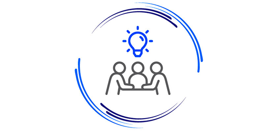 Team collaboration icon with three people around a table and a lightbulb overhead, representing volunteers sharing ideas.