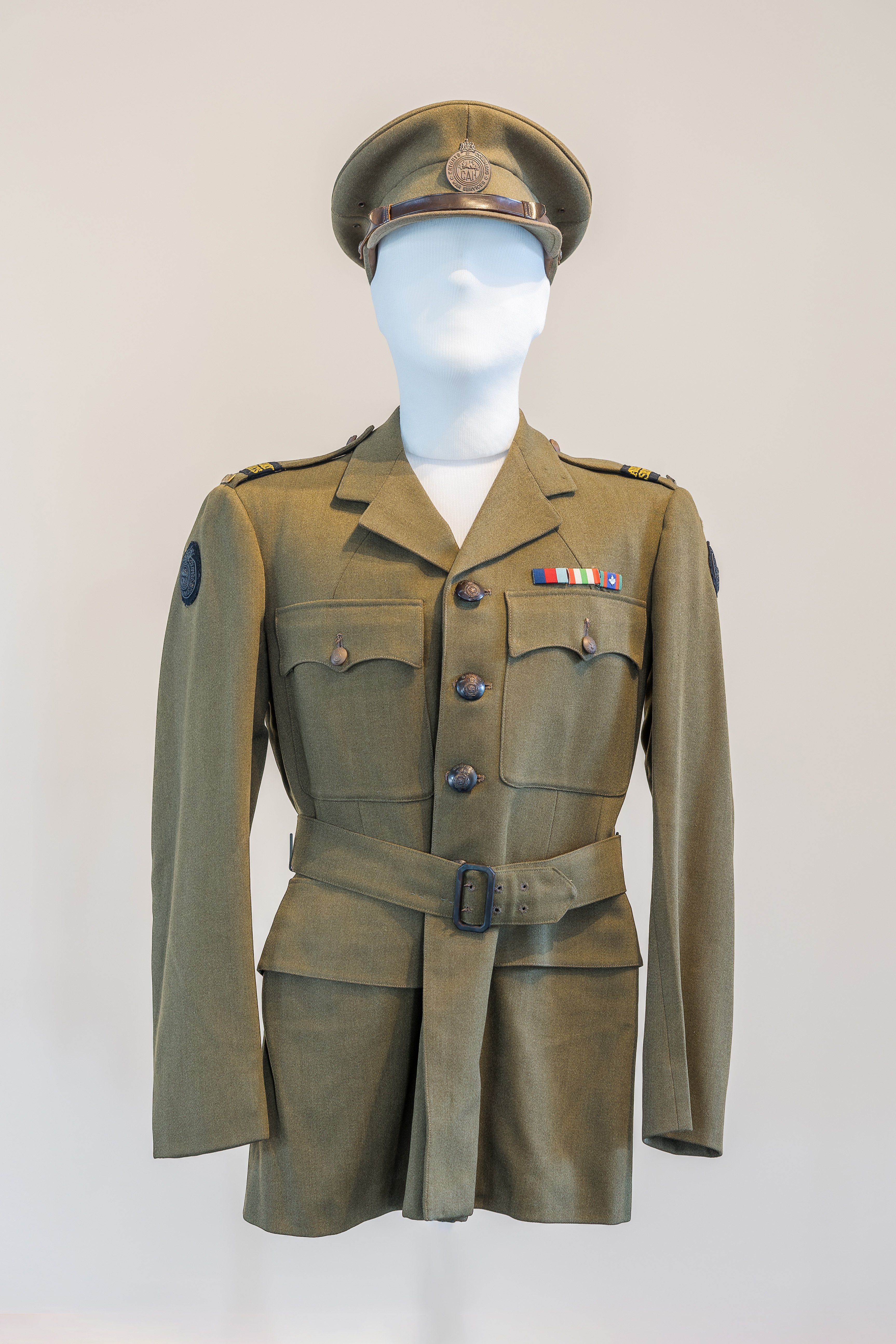 World War II Canadian Auxiliary Services Officer olive drab green peaked cap and dress jacket. 