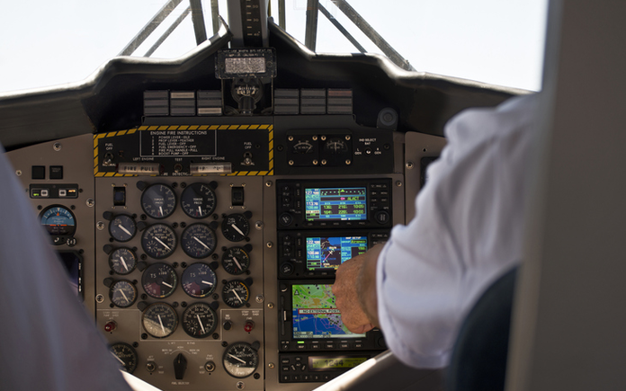 Airplane control panel that uses copper-beryllium strip alloy for connectors. Pilot seated at panel